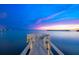 Waterfront dock featuring seating provides a serene space for relaxing and enjoying stunning water views at 2081 Pointe Alexis Dr, Tarpon Springs, FL 34689