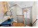 Hallway featuring stylish decor, wooden stairs, and a decorative light fixture at 2081 Pointe Alexis Dr, Tarpon Springs, FL 34689