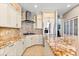 Stylish kitchen featuring granite countertops, stainless steel appliances, and a functional island for meal prep at 2081 Pointe Alexis Dr, Tarpon Springs, FL 34689