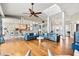 Elegant living room featuring stylish seating, an open floor plan, and natural light at 2081 Pointe Alexis Dr, Tarpon Springs, FL 34689