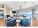Elegant living room featuring comfortable seating, a fireplace, and a beautiful view of the water at 2081 Pointe Alexis Dr, Tarpon Springs, FL 34689
