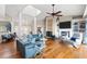 Elegant living room featuring stylish seating, a fireplace, and an open floor plan at 2081 Pointe Alexis Dr, Tarpon Springs, FL 34689