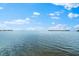 Beautiful water view from the property's edge, showcasing the tranquility of bayfront living at 2081 Pointe Alexis Dr, Tarpon Springs, FL 34689