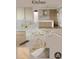 Modern kitchen design featuring marble countertops, gold fixtures and warm wood cabinetry at 211 29Th Ave N, St Petersburg, FL 33704