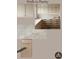 Pantry design featuring white upper cabinets, wood lower cabinets, and marble countertops at 211 29Th Ave N, St Petersburg, FL 33704