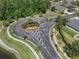 Aerial view of the Quail Woods neighborhood entrance with palm trees and lush landscaping at 27318 Sora Blvd, Wesley Chapel, FL 33544