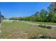 Well-maintained backyard with a privacy fence and a lush lawn at 27318 Sora Blvd, Wesley Chapel, FL 33544
