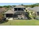 Aerial view of the home's backyard and screened in porch at 27318 Sora Blvd, Wesley Chapel, FL 33544