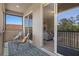 Balcony featuring comfortable seating with access to the living room at 27318 Sora Blvd, Wesley Chapel, FL 33544