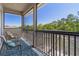 Relaxing balcony with seating and a view of the surrounding trees at 27318 Sora Blvd, Wesley Chapel, FL 33544