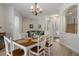 Open dining area with a view of the foyer, stairs, and living room at 27318 Sora Blvd, Wesley Chapel, FL 33544