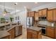 Modern kitchen features a stylish island and stainless steel appliances at 27318 Sora Blvd, Wesley Chapel, FL 33544
