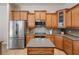 A kitchen featuring stainless steel appliances, an island, and lots of cabinet storage space at 27318 Sora Blvd, Wesley Chapel, FL 33544