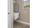 Charming laundry room with sink and window for natural light at 27318 Sora Blvd, Wesley Chapel, FL 33544