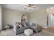 Cozy living room featuring a neutral color palette and comfortable seating at 27318 Sora Blvd, Wesley Chapel, FL 33544