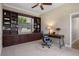 This office features custom built-in bookshelves and plenty of natural light at 27318 Sora Blvd, Wesley Chapel, FL 33544