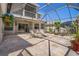 Wide angle view of a screened patio with a seating area and view of the backyard at 27318 Sora Blvd, Wesley Chapel, FL 33544