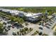 Aerial view of a busy shopping center featuring various stores and ample parking at 27318 Sora Blvd, Wesley Chapel, FL 33544