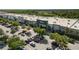 Retail shops in a large shopping center with ample parking and well-maintained landscaping, visible signage, and diverse retailers at 27318 Sora Blvd, Wesley Chapel, FL 33544