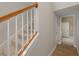 Traditional stairway features carpeted treads and white painted risers at 27318 Sora Blvd, Wesley Chapel, FL 33544