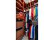 Walk-in closet with custom shelving and organization solutions at 27318 Sora Blvd, Wesley Chapel, FL 33544