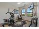 Bright home exercise room with workout equipment, natural light, and a view at 2746 Via Tivoli # 135A, Clearwater, FL 33764