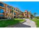 Beautiful two-story condo featuring lush landscaping, a sidewalk, and a classic architectural design at 2746 Via Tivoli # 135A, Clearwater, FL 33764