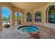 Relaxing octagonal hot tub in an indoor/outdoor space with access to an outdoor pool, perfect for leisure and recreation at 2746 Via Tivoli # 135A, Clearwater, FL 33764