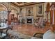 Formal living room with fireplace, ornate columns, and elegant furnishings, creating a luxurious and inviting space at 2746 Via Tivoli # 135A, Clearwater, FL 33764
