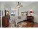 Comfortable main bedroom featuring hardwood floors, elegant furnishings, and abundant natural light at 2746 Via Tivoli # 135A, Clearwater, FL 33764