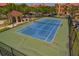 Well-maintained blue and green tennis court, perfect for an active lifestyle in a vibrant community at 2746 Via Tivoli # 135A, Clearwater, FL 33764