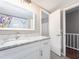 Bathroom vanity featuring gray tile floor, a white cabinet, and granite countertops at 320 Island Way # 606, Clearwater Beach, FL 33767