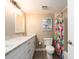 Bright bathroom boasts a bathtub with sleek hardware, and colorful art at 320 Island Way # 606, Clearwater Beach, FL 33767