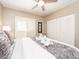 Bedroom with closet, ceiling fan, and decorative towels on the bed at 320 Island Way # 606, Clearwater Beach, FL 33767