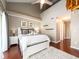 Bright bedroom features a ceiling fan, a plush rug and an ensuite bath at 320 Island Way # 606, Clearwater Beach, FL 33767