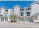 Desirable condo community with well-manicured landscaping, private garages, and inviting exterior design at 320 Island Way # 606, Clearwater Beach, FL 33767