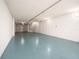 Spacious garage features bright, coated floor, room for storage, and ample space at 320 Island Way # 606, Clearwater Beach, FL 33767
