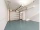 Garage includes automatic door, coated floor, and access to interior of the home at 320 Island Way # 606, Clearwater Beach, FL 33767