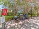 Community grill area surrounded by lush, mature landscaping at 320 Island Way # 606, Clearwater Beach, FL 33767