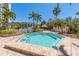Community hot tub surrounded by brick patio and lush landscaping at 320 Island Way # 606, Clearwater Beach, FL 33767