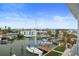 Aerial view of boat dock and houses with a clear blue sky at 326 129Th E Ave, Madeira Beach, FL 33708