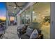 Spacious balcony features white marble floors, modern railings, and an entrance into the home at 326 129Th E Ave, Madeira Beach, FL 33708