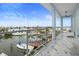 Spacious balcony features white marble floors, modern railings, and views of the neighborhood at 326 129Th E Ave, Madeira Beach, FL 33708