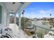 Outdoor balcony with seating overlooking harbor with boats at 326 129Th E Ave, Madeira Beach, FL 33708