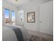 Sunlit bedroom showcasing a mirror reflecting the bed, plus natural light streaming through the windows at 326 129Th E Ave, Madeira Beach, FL 33708
