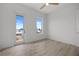 Well-lit bedroom with views from the windows and a glass panel door to balcony at 326 129Th E Ave, Madeira Beach, FL 33708