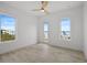 Spacious bedroom with lots of natural light, wood flooring, and a ceiling fan at 326 129Th E Ave, Madeira Beach, FL 33708