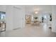 A bright and airy dining room with modern chandelier, gold accents, and plenty of natural light at 326 129Th E Ave, Madeira Beach, FL 33708