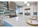 Spacious kitchen with an island, modern appliances, a stylish range hood, and plenty of natural light at 326 129Th E Ave, Madeira Beach, FL 33708