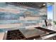 Detailed view of a gas stovetop with a stainless steel range hood and a decorative backsplash at 326 129Th E Ave, Madeira Beach, FL 33708